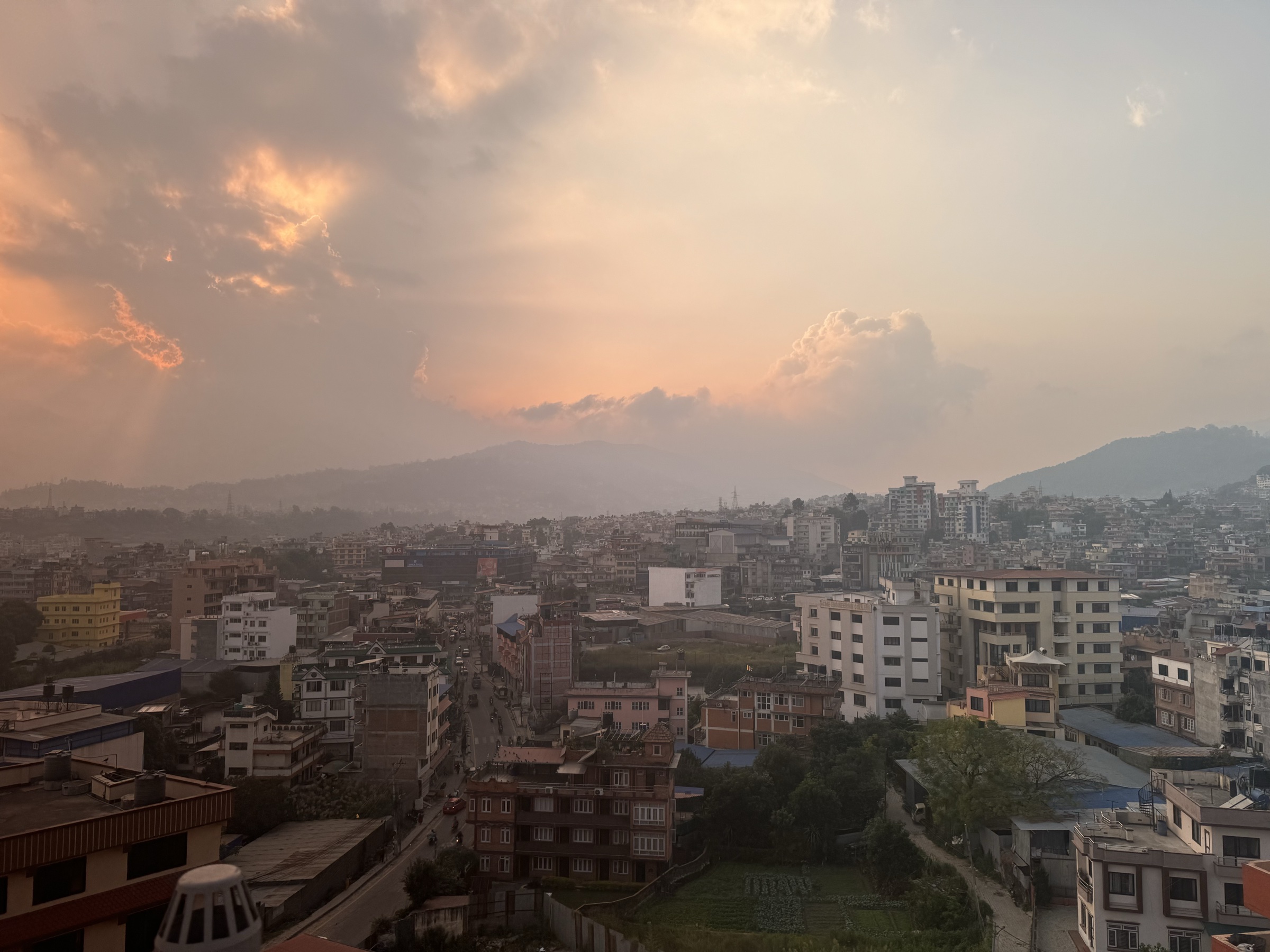 The valley city at dusk, the lamps coming on
