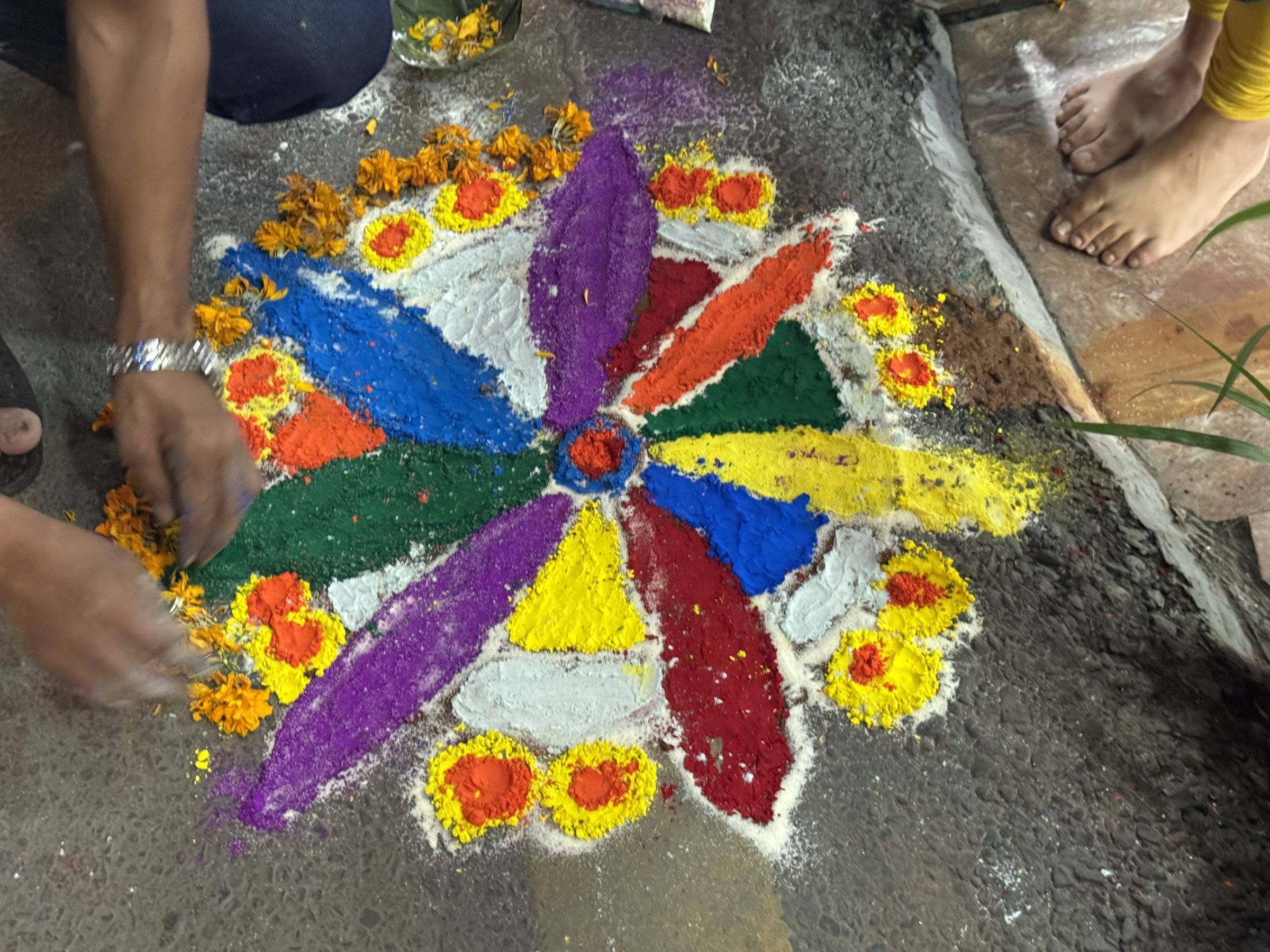 A coloured mandala on the ground