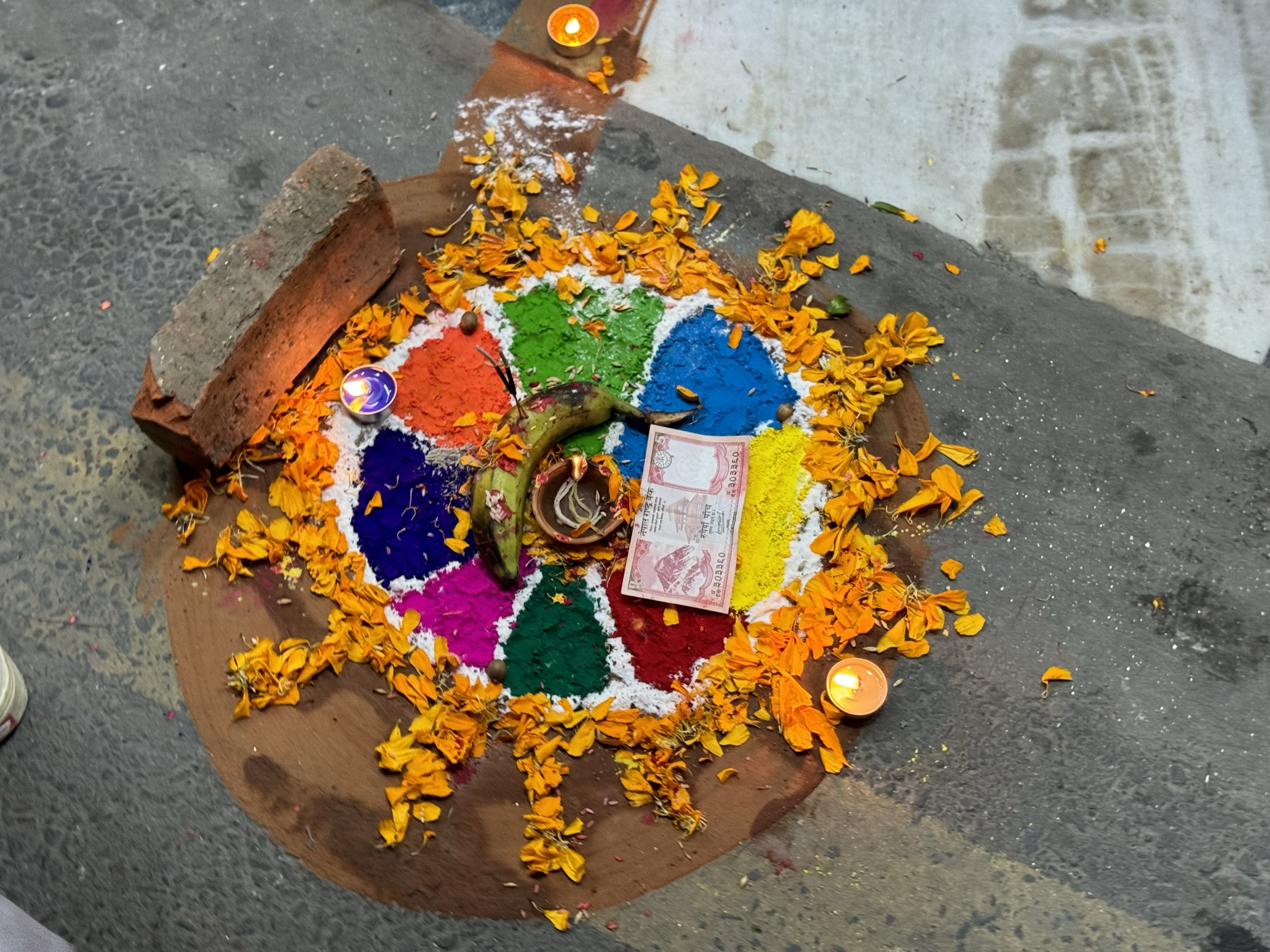 A coloured mandala at a doorway